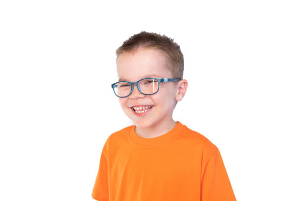 istock Little cute boy with glasses smiling isolated on white background 1161960484