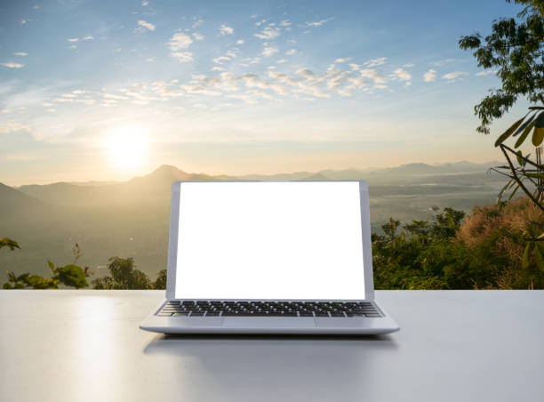 istock Notebook Laptop in the office The background nature and mountains 1161961343