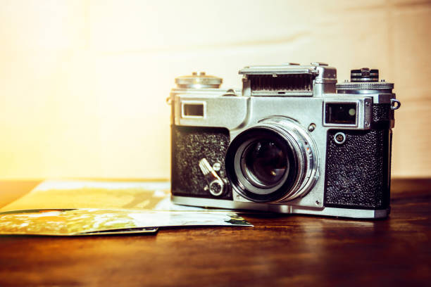 istock old camera is on the table on a stack of photos 1161961391