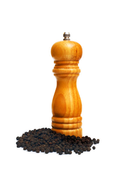 istock wooden pepper mill with peppercorns isolated on white background 1161962641