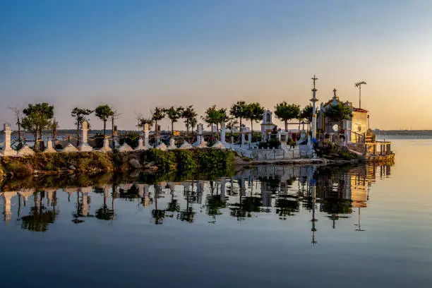 Summer evening view of Madonna di Fatima Church at Mar Piccolo or Little Sea in Apulia, Province of Taranto, Italy