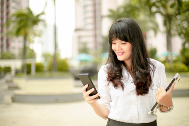 istock business woman with smartphone 1161962915
