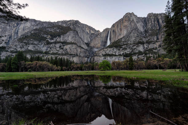 istock Yosemite Falls and reflection on Merced River, El Capitan Meadow, California 1161964070