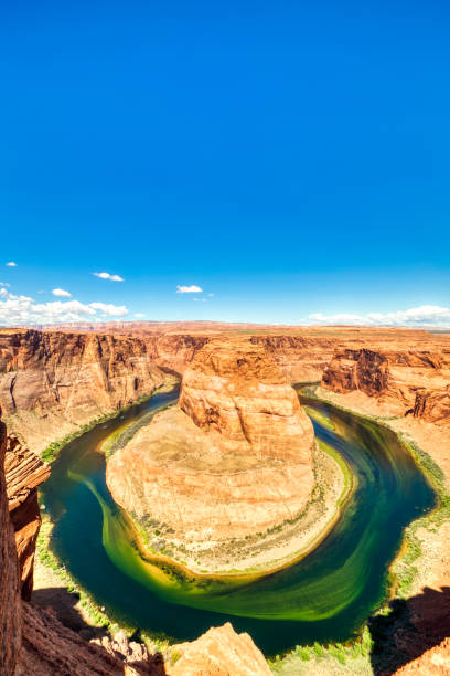istock Horseshoe Bend on Colorado River with Bright Blue Sky, Utah 1161965733