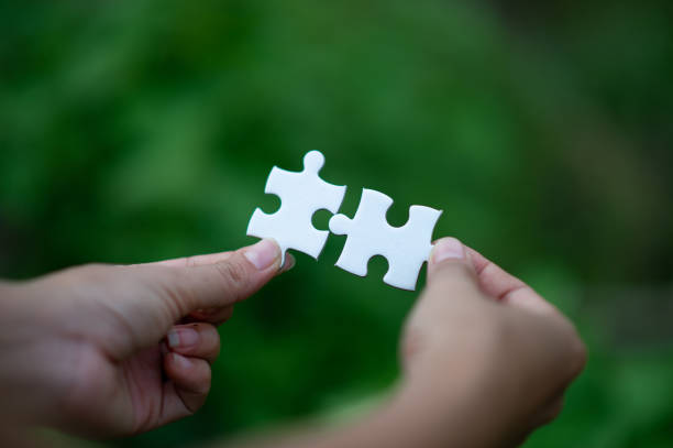 istock Hands and puzzles, important pieces of teamwork Teamwork concept 1161968193