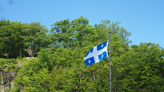 View of a Quebec flag flying in the wind.