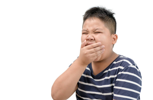 istock a tired obese fat boy yawning isolated 1161975317
