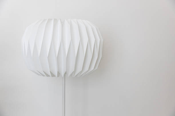 istock The single unique round shape paper electric floor lamp on white wall background. 1161976458
