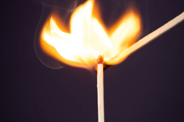 istock Close up Macro shot of a ignition match on a second match captured in super slow motion 1161977542