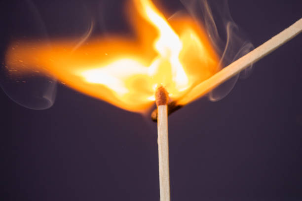 istock Close up Macro shot of a ignition match on a second match captured in super slow motion 1161977745