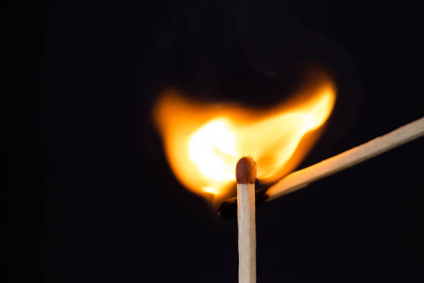 istock Close up Macro shot of a ignition match on a second match captured in super slow motion 1161977792