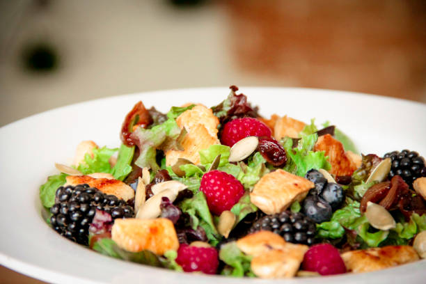 istock Healthy salad bowl with grilled chicken, caramelized onion and berries. 1161978280
