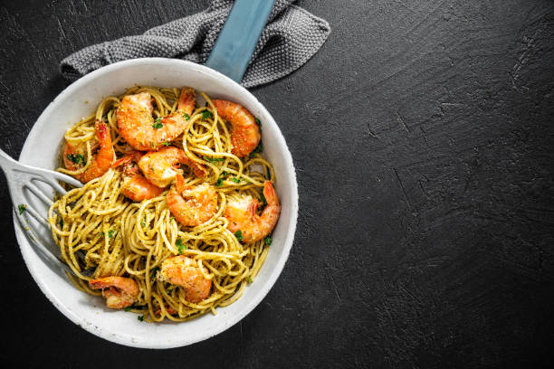 istock Grilled shrimps on pan on dark background 1161980838