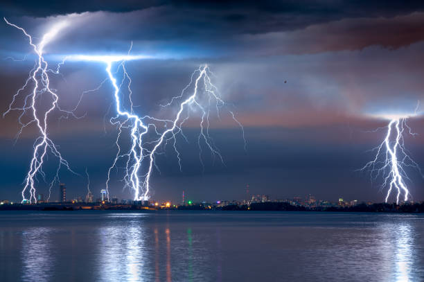 istock strong thunderstorm with lightning over the city 1161982414