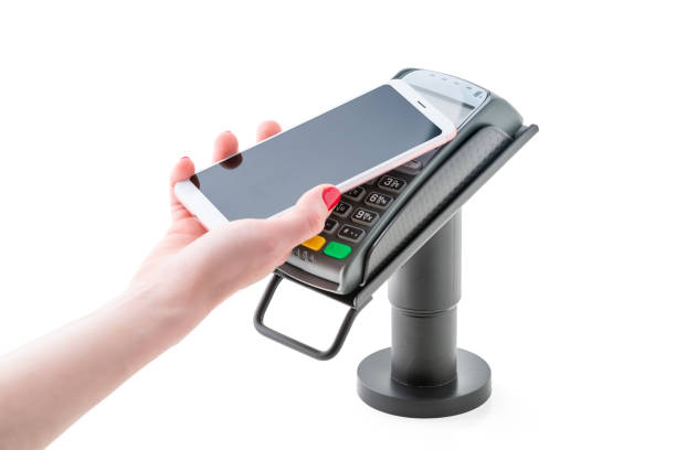 contactless payment through a bank terminal and a smartphone with NFC stock photo