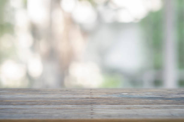 istock image of wooden table in front of abstract blurred background 1161983019