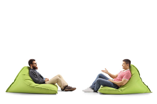 istock Two men on bean bags having a conversation 1161986160
