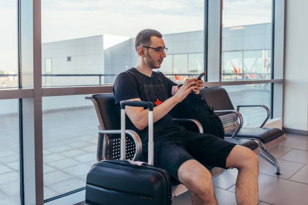 istock Man waiting boarding in arrival hall at airport 1161989214