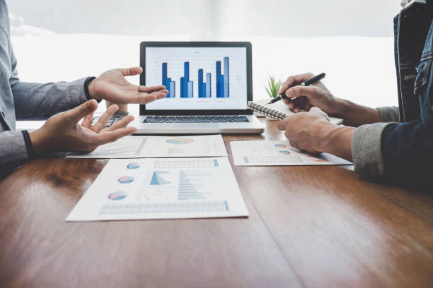 istock Business casual team meeting working with new startup project, discussion and analysis data the charts and graphs, computer using, Business finances and strategy accounting concept 1161989339