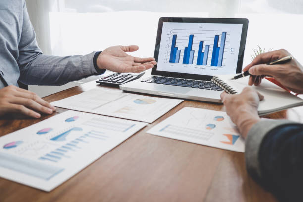istock Business team casual collaboration discussing working analysis with financial data and marketing growth report graph in team, Meeting Talking Brainstorming Communication Concept 1161989342