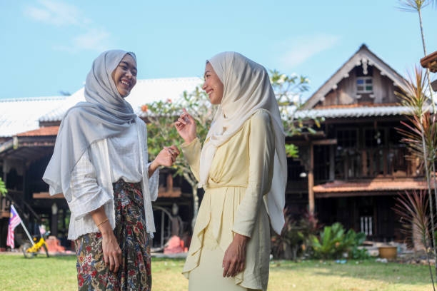 istock Two Young Malay Muslim Women Chatting 1161990440