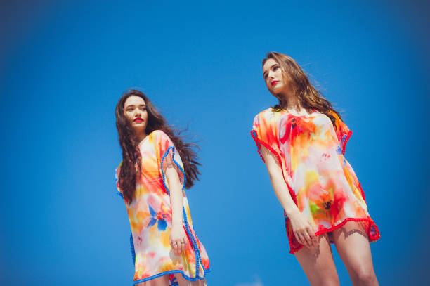 istock Two beautiful young women on the beach 1161990556