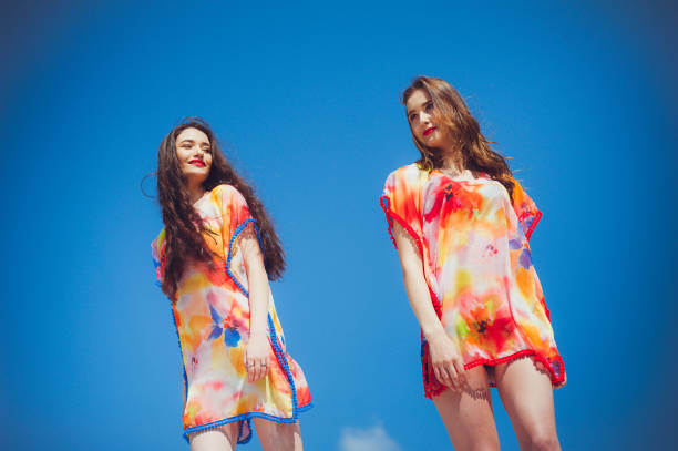 istock Two beautiful young women on the beach 1161990716