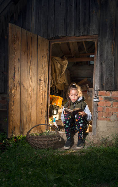 Girl reading an old book.