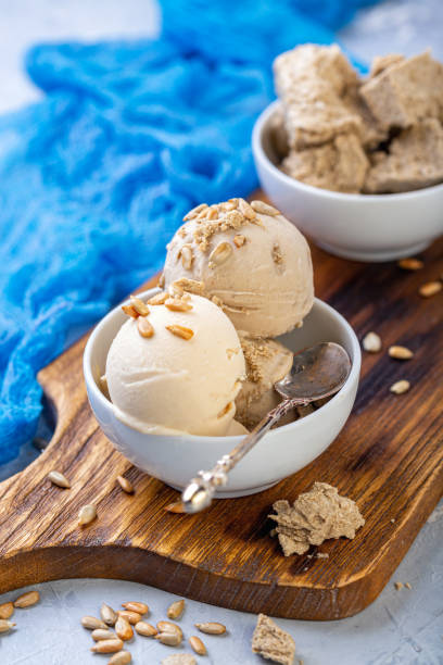 istock Ice cream with seeds and halva in a white bowl. 1161992074