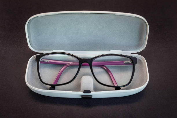 istock Stylish black and purple eyeglasses, inside the box. 1161992750