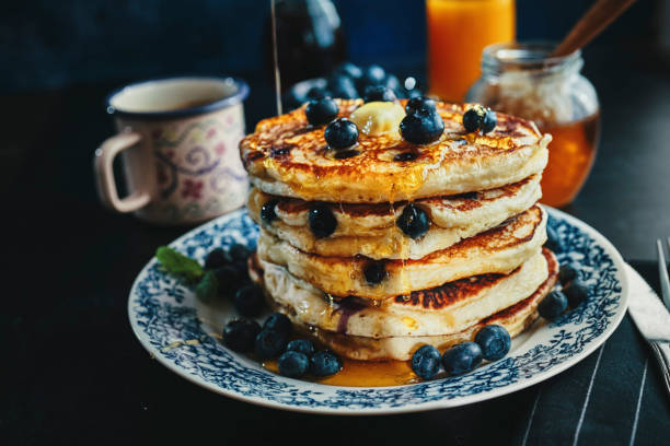 istock Stack of Pancakes with Maple Syrup and Fresh Blueberries 1161996758