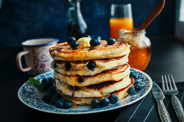 istock Stack of Pancakes with Maple Syrup and Fresh Blueberries 1161996766