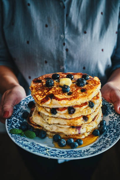 istock Stack of Pancakes with Maple Syrup and Fresh Blueberries 1161996767