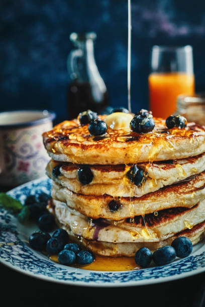 istock Stack of Pancakes with Maple Syrup and Fresh Blueberries 1161996771