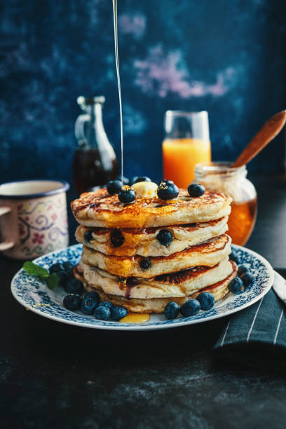 istock Stack of Pancakes with Maple Syrup and Fresh Blueberries 1161996774