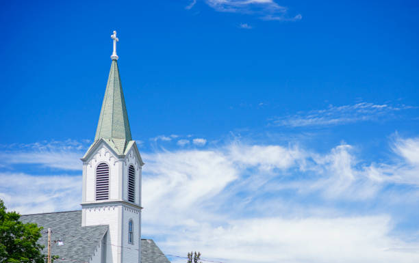 istock White Church Steeple and Blue Sky 1162001705