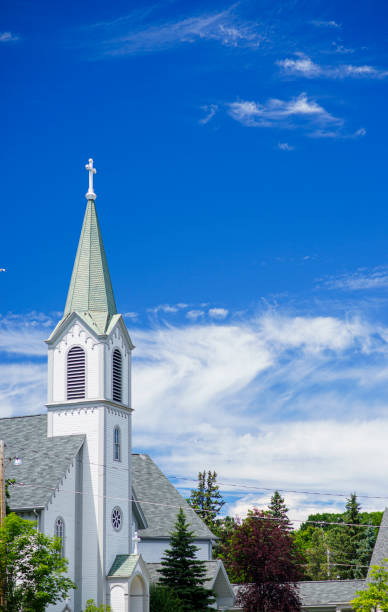 istock White Church Steeple and Blue Sky 1162001930