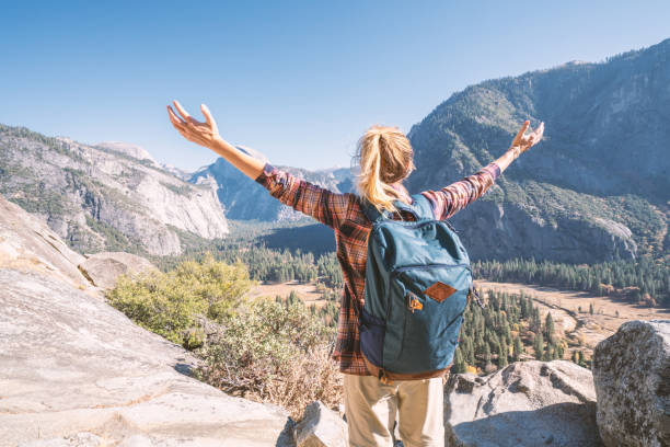 istock Arms wide open, woman embracing nature 1162002815