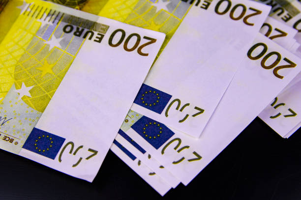 istock European currency euro on a black background. 1162002818