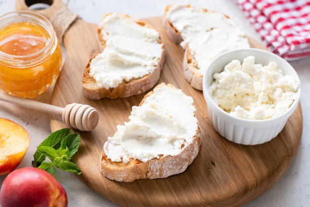 Bruschetta with ricotta cheese Bruschetta with ricotta cheese on wooden board. Healthy tasty appetizer Ricotta stock pictures, royalty-free photos & images