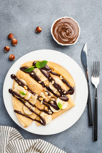 istock Crepes with chocolate sauce, banana and nuts 1162008085
