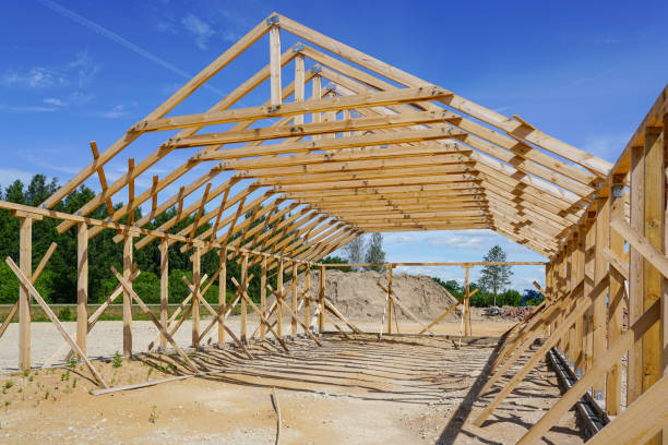 istock Frame of a new wooden house under construction 1162009864