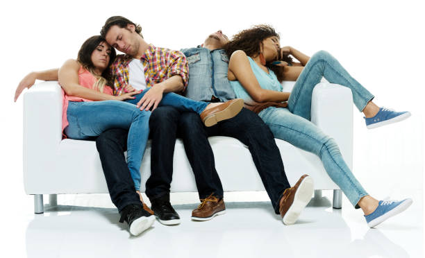 istock Four people are tired and resting / sleeping on sofa / couch 1162009923