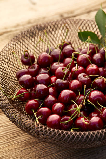 istock Fresh cherries on a fancy epergne on a wooden table 1162013226