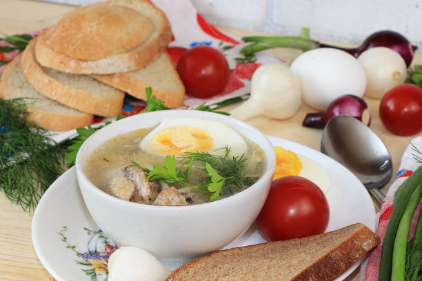 istock Traditional Russian soup with egg and bread on a wooden table. 1162016427