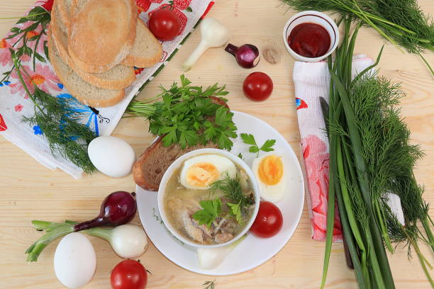 istock Traditional Russian soup with egg and bread on a wooden table. 1162016533