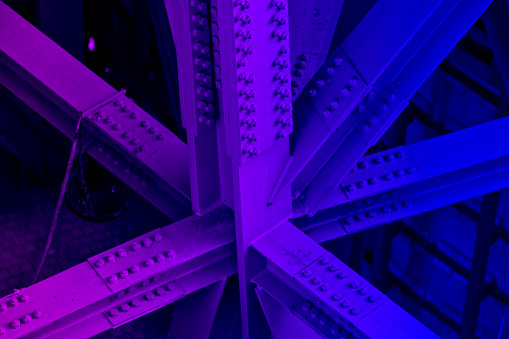 Bridge frame closeup neon colored. Horizontal purple and blue glowing toned image