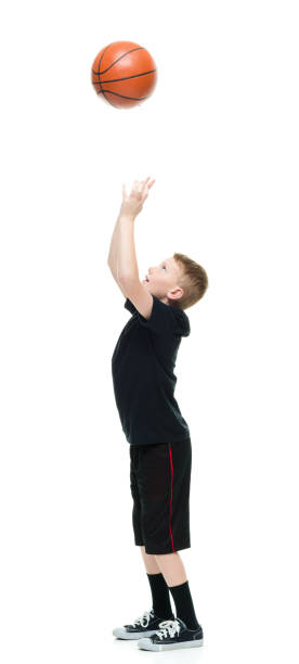 istock 8 year old boy with a basketball 1162019491