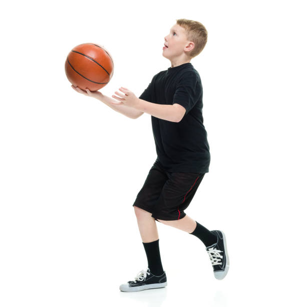 istock 8 year old boy with a basketball 1162019503