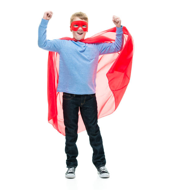 istock 8 year old boy wearing superhero costume 1162020725